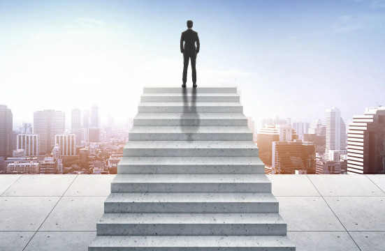 vision-concept-successful-businessman-standing-staircase