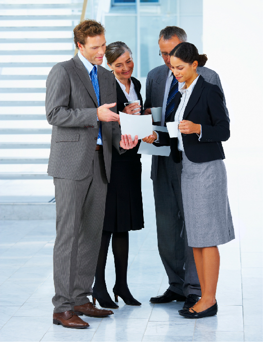 Photo of people looking at a document